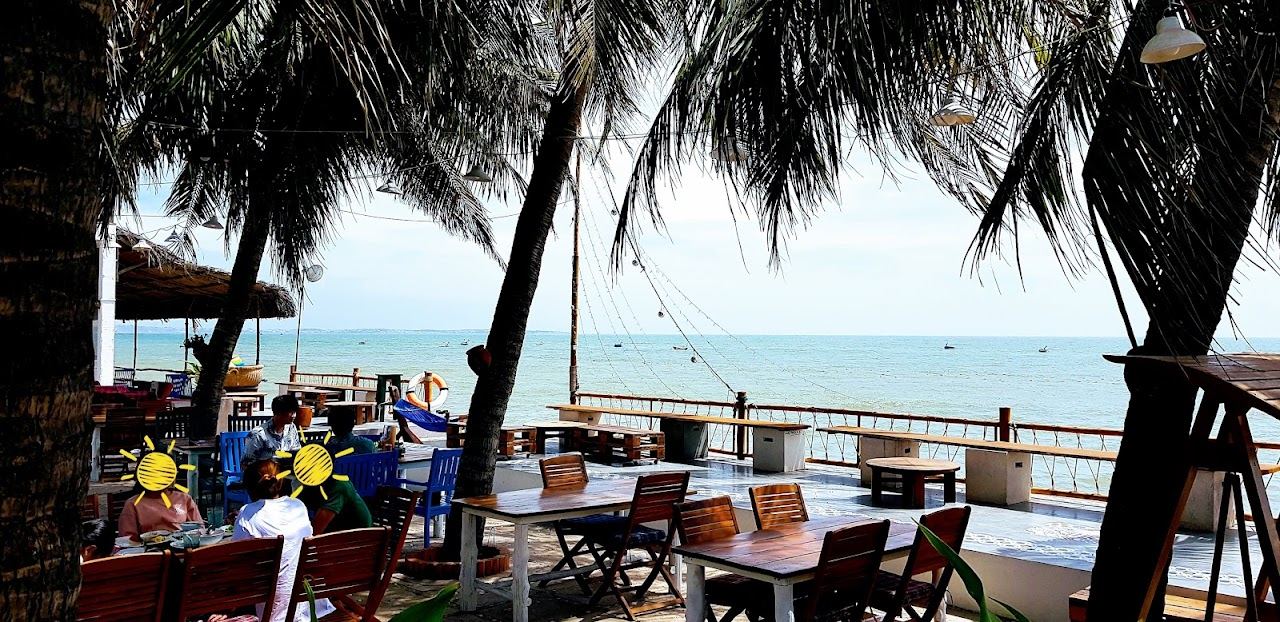 A beach bar lit up at dusk on the Mui Ne strip in Vietnam