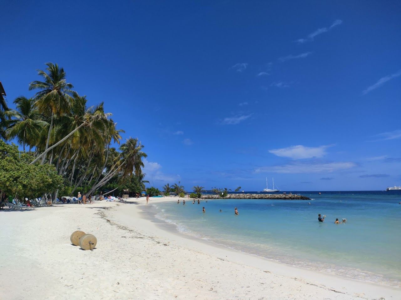 The designated tourist bikini beach with sunbeds and clear water on Maafushi island