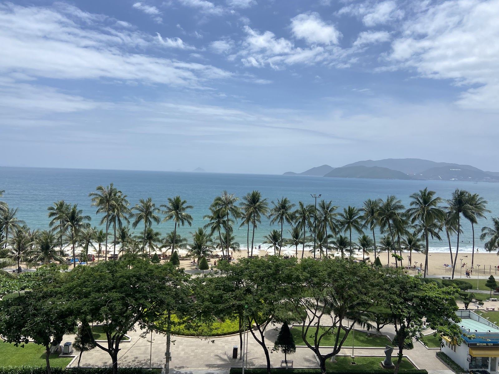 Long free public city beach and calm water along the seafront at Nha Trang Vietnam