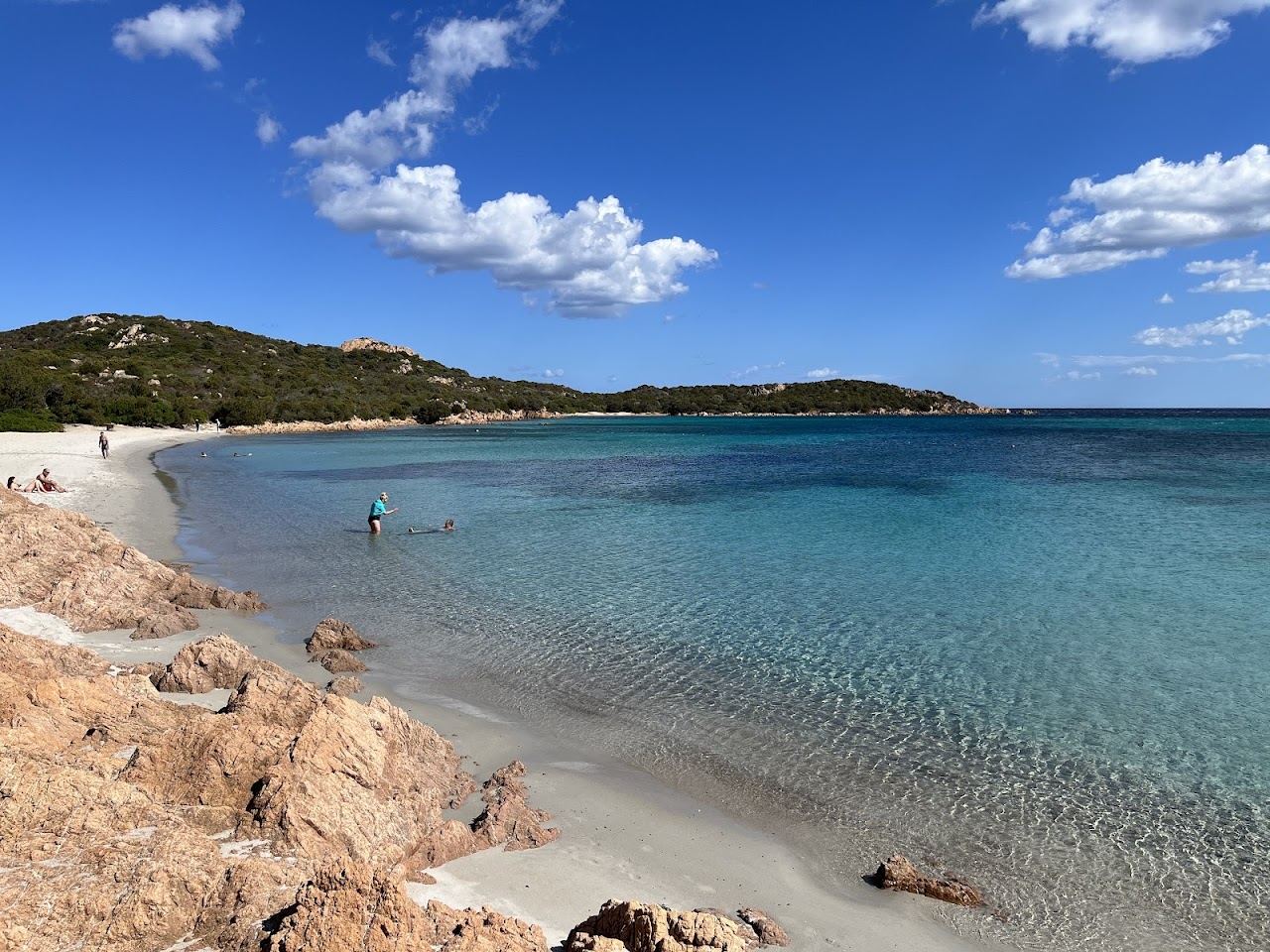Clear turquoise water and granite headlands at Cala Petra Ruja cove on the Costa Smeralda, Sardinia