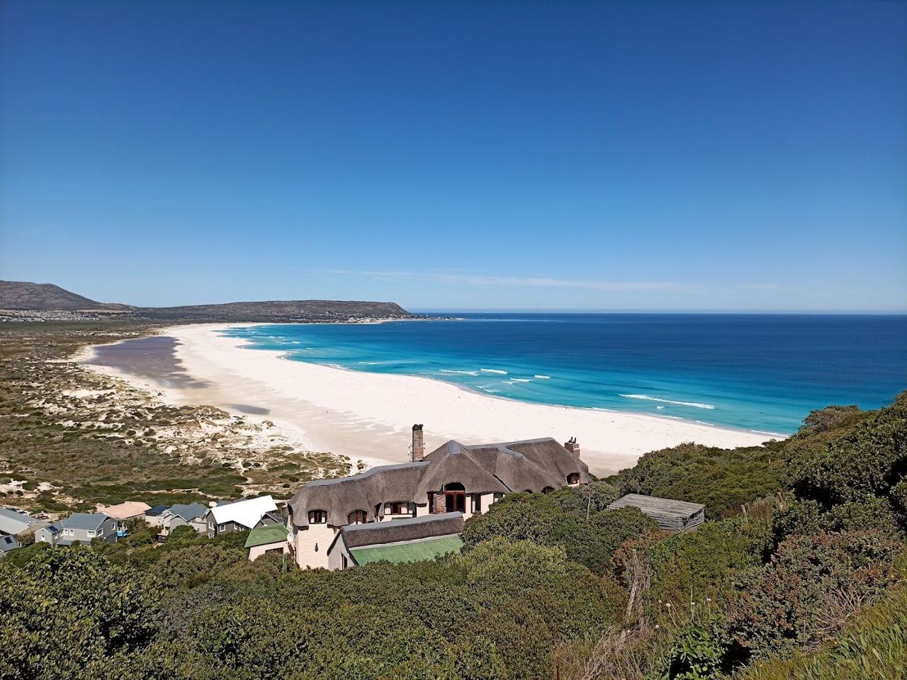 Noordhoek Long Beach white sand and Chapmans Peak in Cape Town