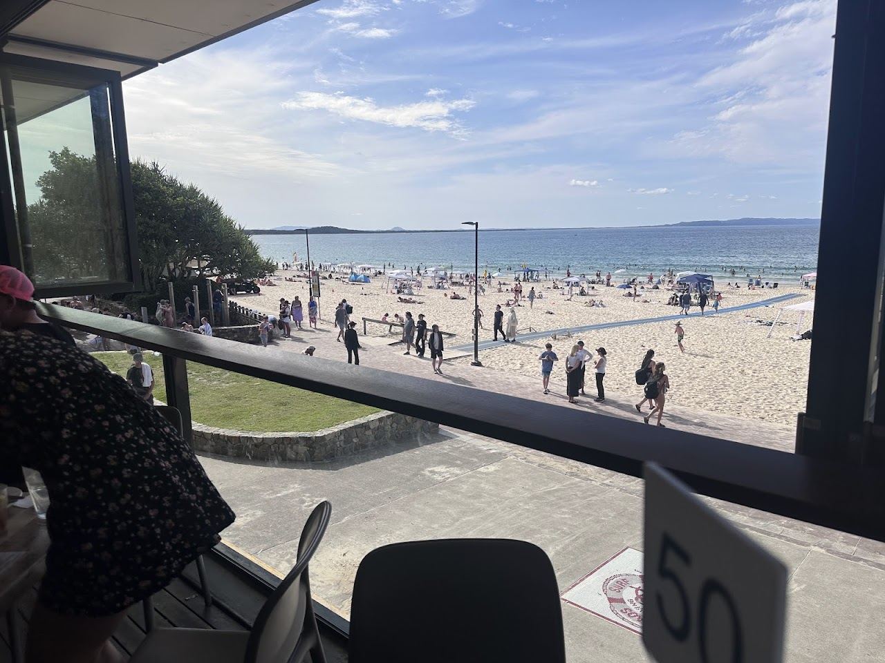 Noosa Main Beach meeting the cafes and foreshore of Hastings Street in Noosa Heads