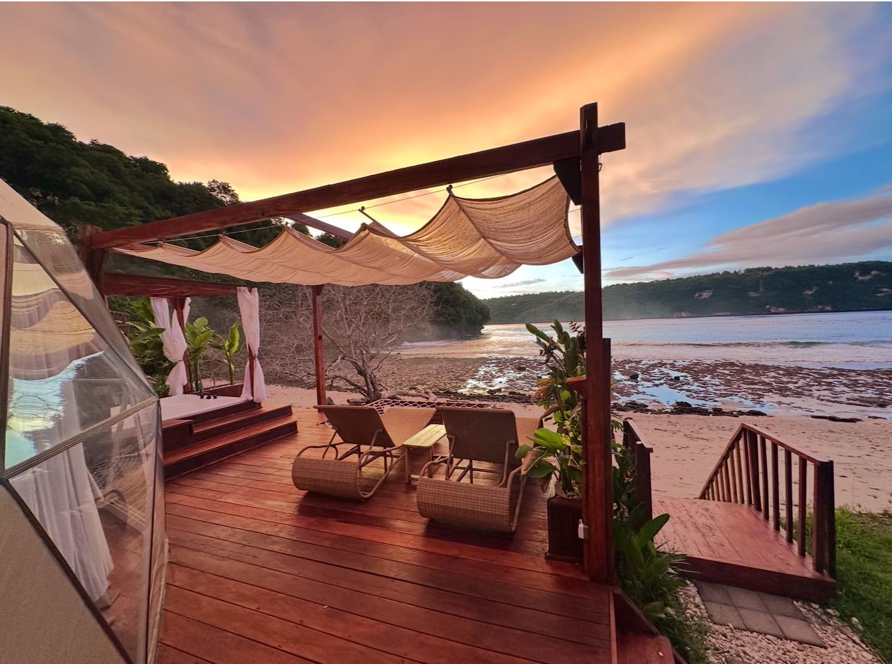 The clear water and rugged cliff framed cove of Gamat Bay on the west coast of Nusa Penida