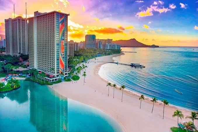 Evening light over the surf and sand at Waikiki Beach on the south shore of Oahu