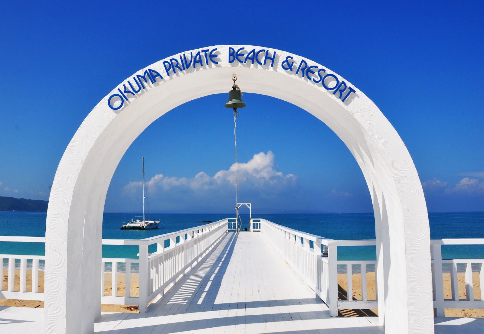 The calm shallows and loungers of the resort beach at Okuma in northern Okinawa