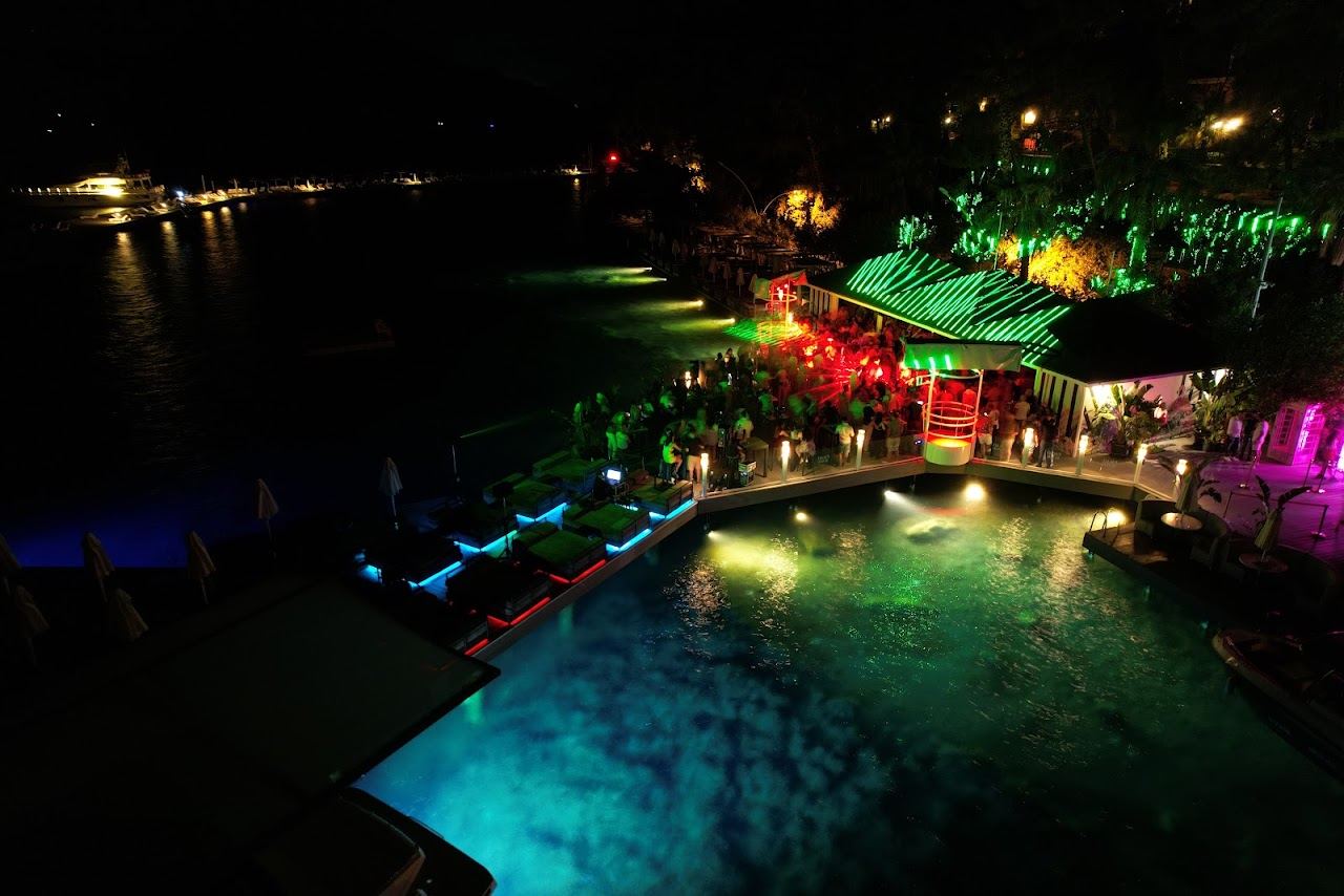 Sunbeds along the jetty and seafront of Palace Beach Club at Pamucak point near Icmeler, Marmaris