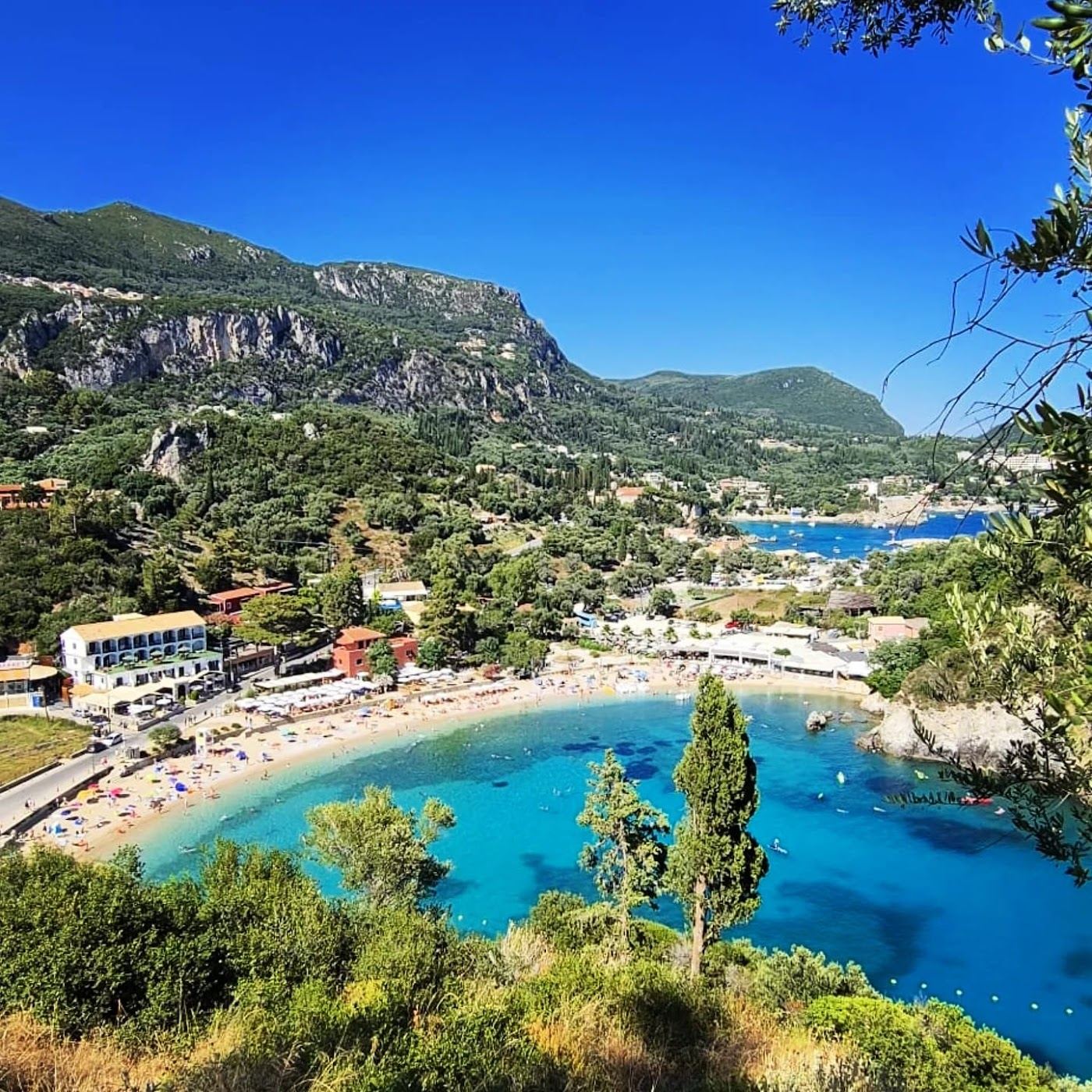 Clear water and green cliffs at a cove in Paleokastritsa, Corfu