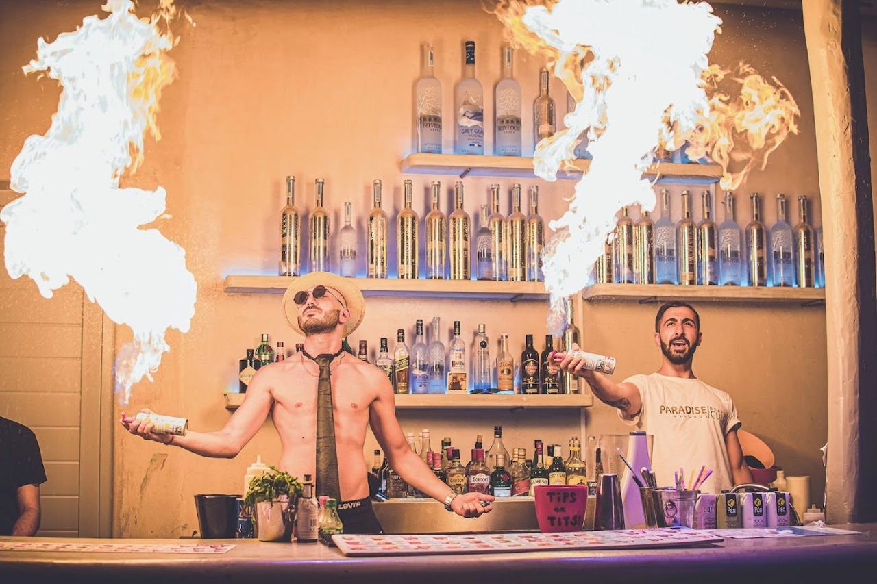 Party crowds and golden sand at Paradise Beach in southern Mykonos