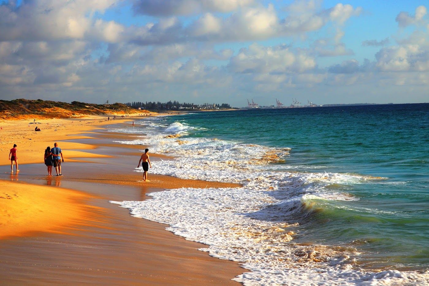 The grassy foreshore and gentle sand of City Beach in Perth, an easy family beach