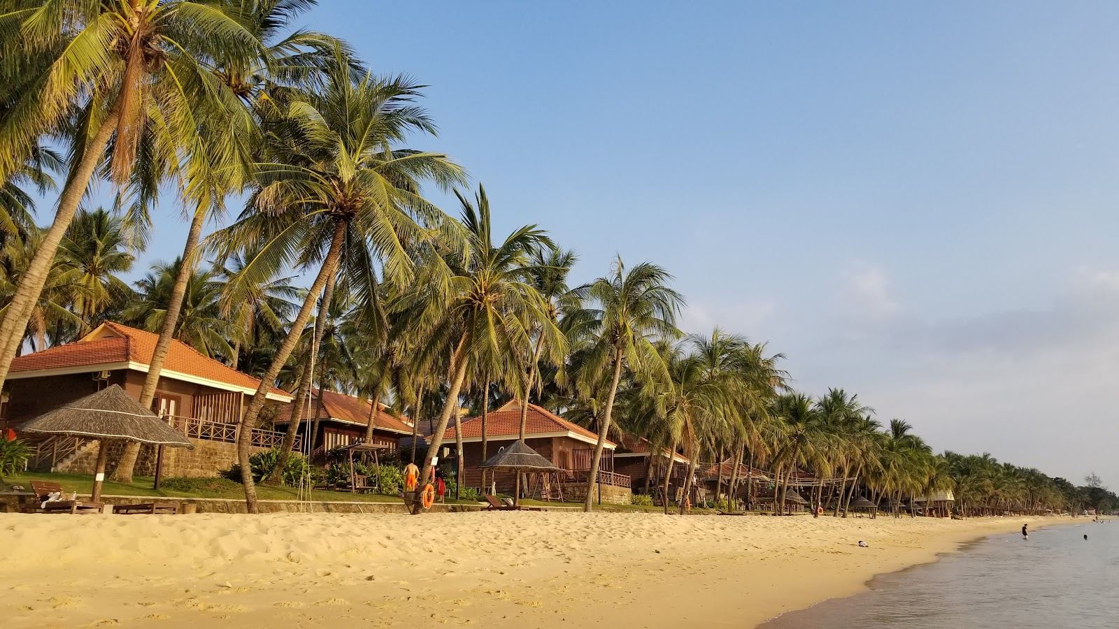 Long free public sand and a calm sea at Bai Truong Long Beach in Phu Quoc, Vietnam
