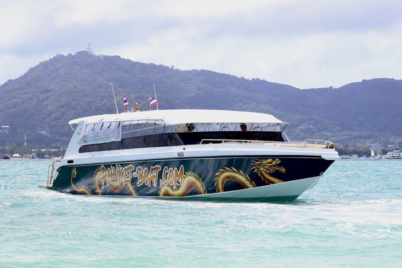 Longtail boats along the front at Rawai Beach in Phuket