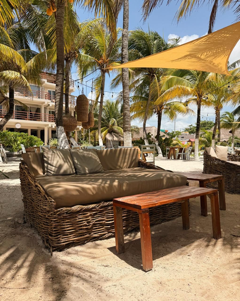 Beach clubs and loungers along the golden sand of Playa Camarones on the Puerto Vallarta seafront