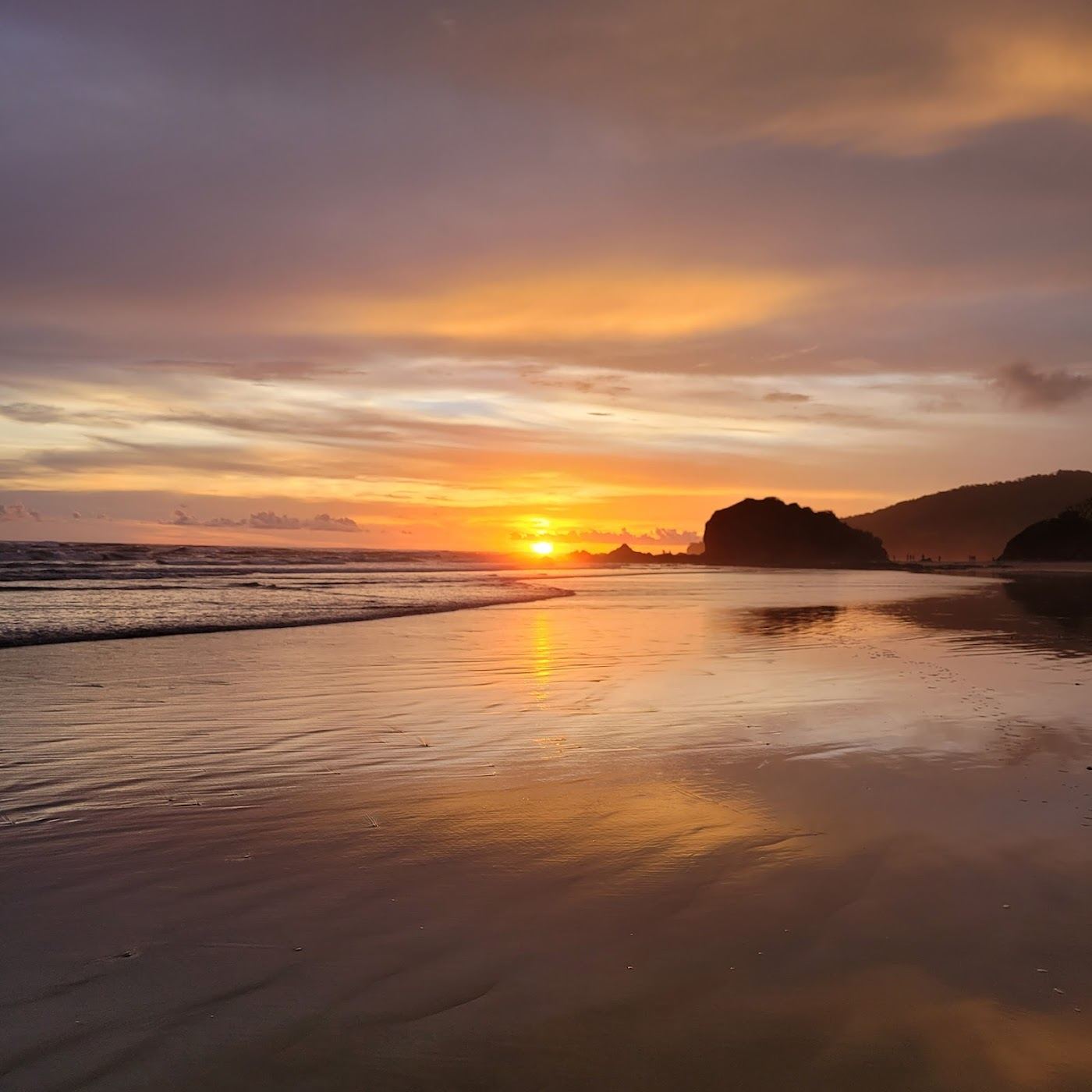 Long undeveloped sweep of sand and ocean at Playa Grande near Tamarindo