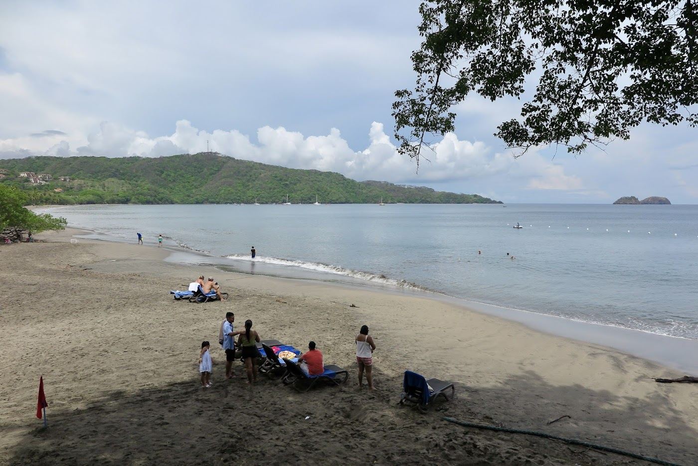 Calm sheltered bay and grey gold sand at Playa Hermosa in Guanacaste Costa Rica