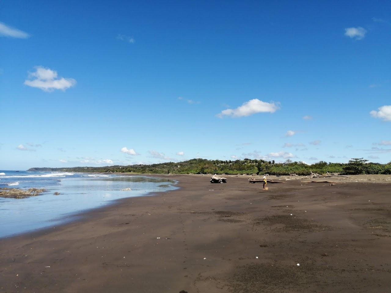 Wild gray sand and the river mouth at Playa Nosara in Guanacaste Costa Rica
