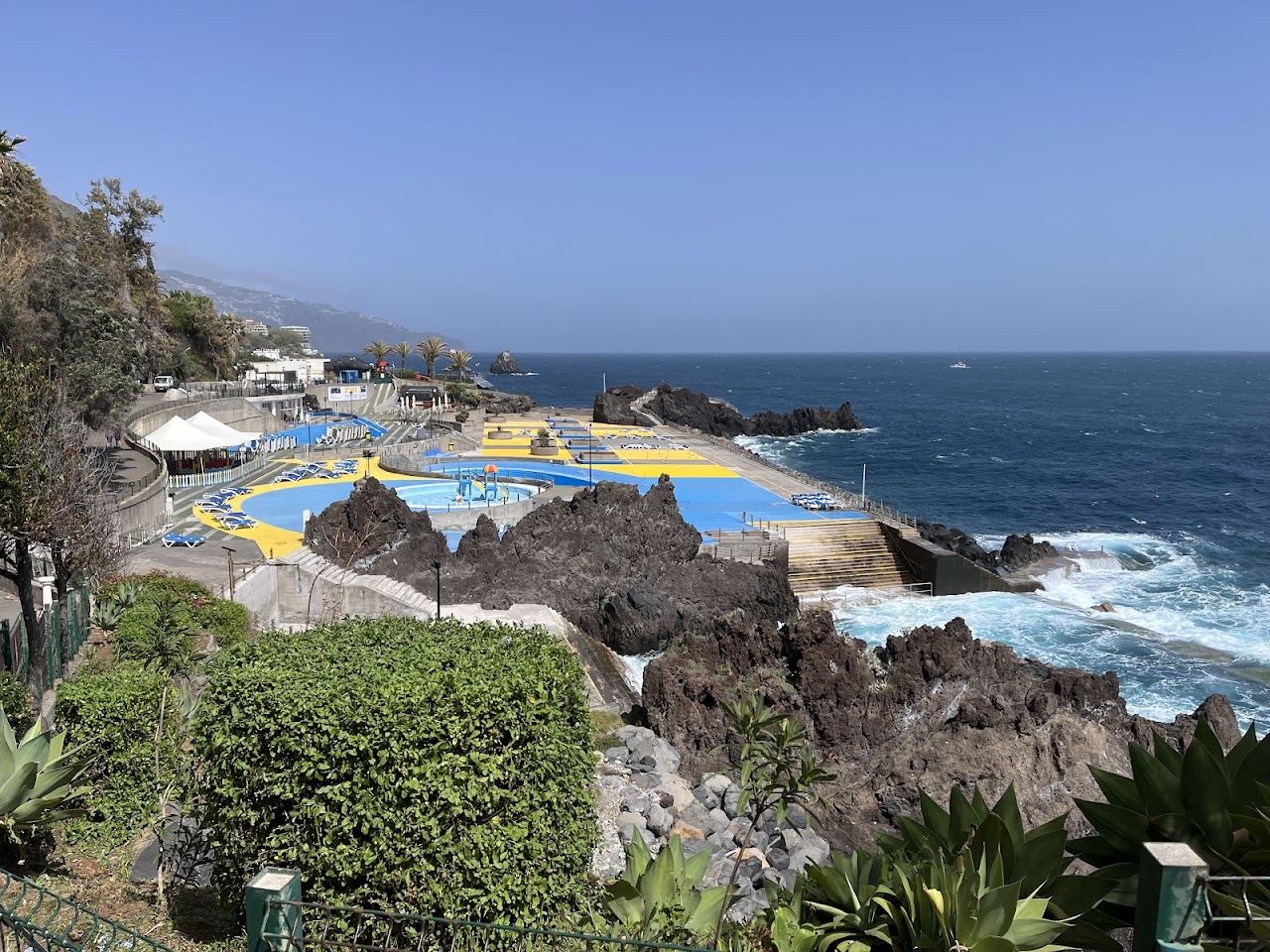 Saltwater pools and sun deck of the Ponta Gorda bathing complex beside the Atlantic in Funchal