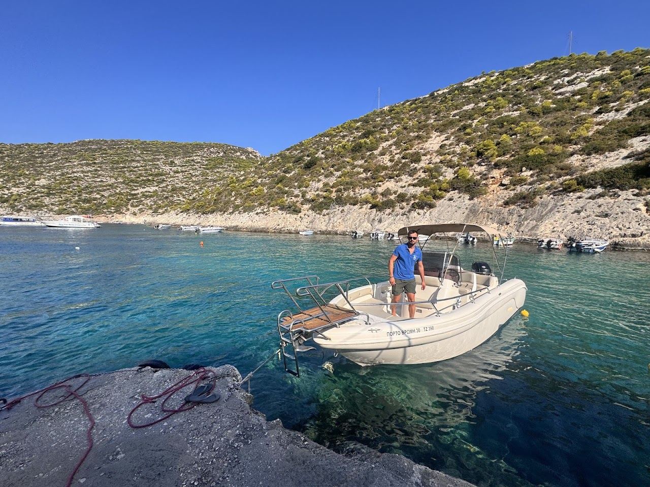The clear turquoise water and small rocky cove of Porto Vromi on the wild west coast of Zakynthos