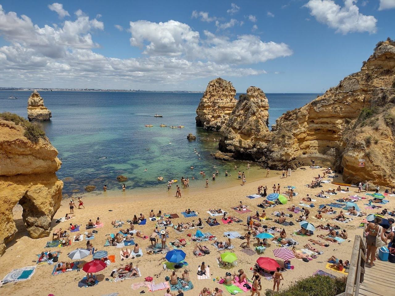 Praia do Camilo wooden stairway and twin golden coves near Lagos in the Algarve