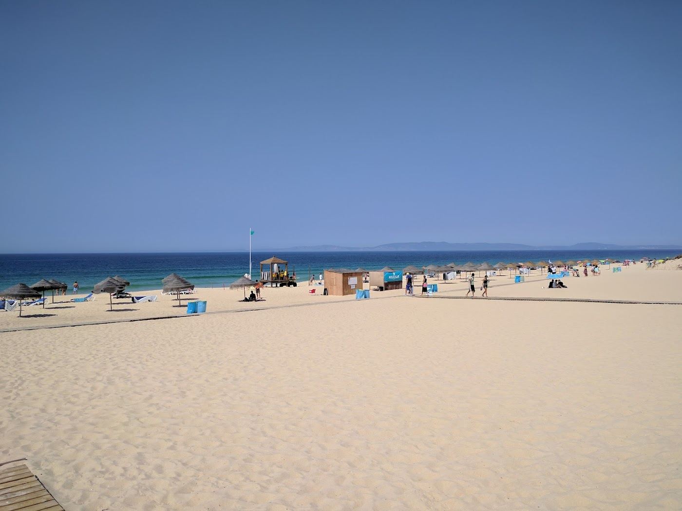 The boardwalk and dunes leading onto the wide Atlantic sand at Praia do Carvalhal