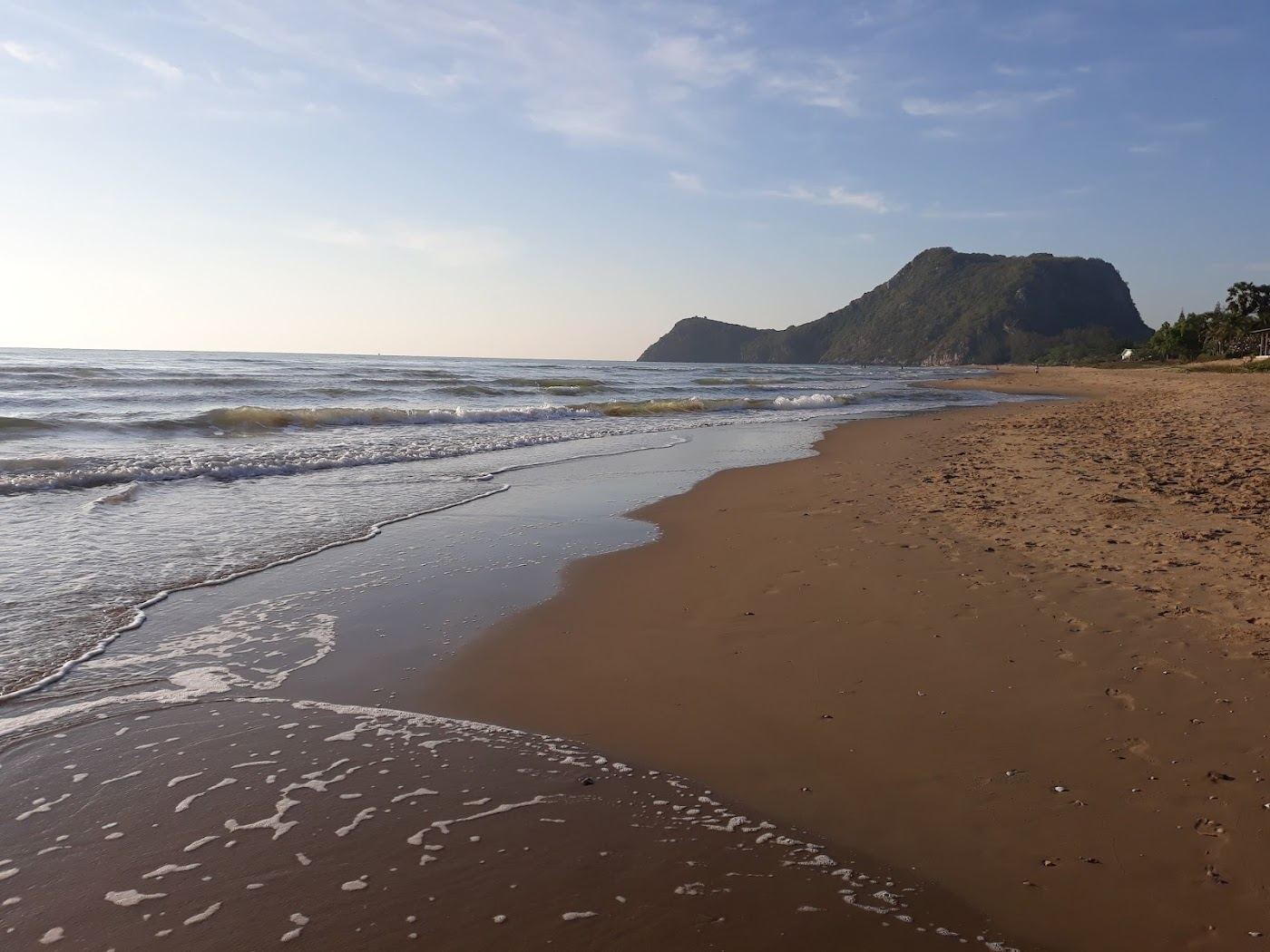 The soft golden sand and calm Gulf water of Pranburi Beach at Pak Nam Pran south of Hua Hin