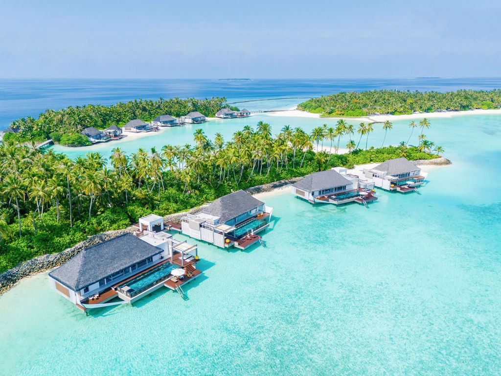 Modern villas over clear water at Cheval Blanc Randheli in the Maldives