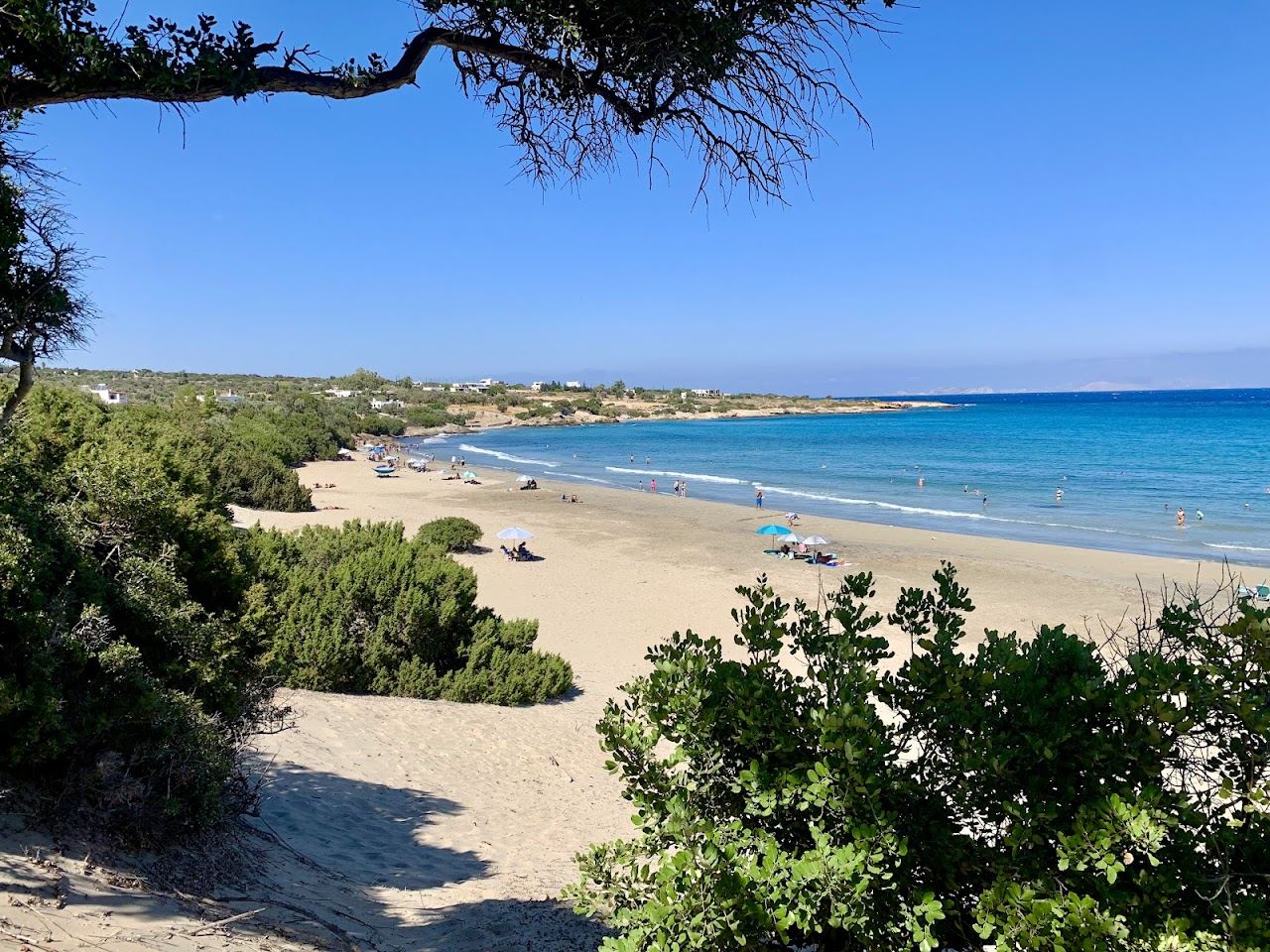 The empty fine sand and shallow clear water of Psili Ammos beach on the east coast of Naxos