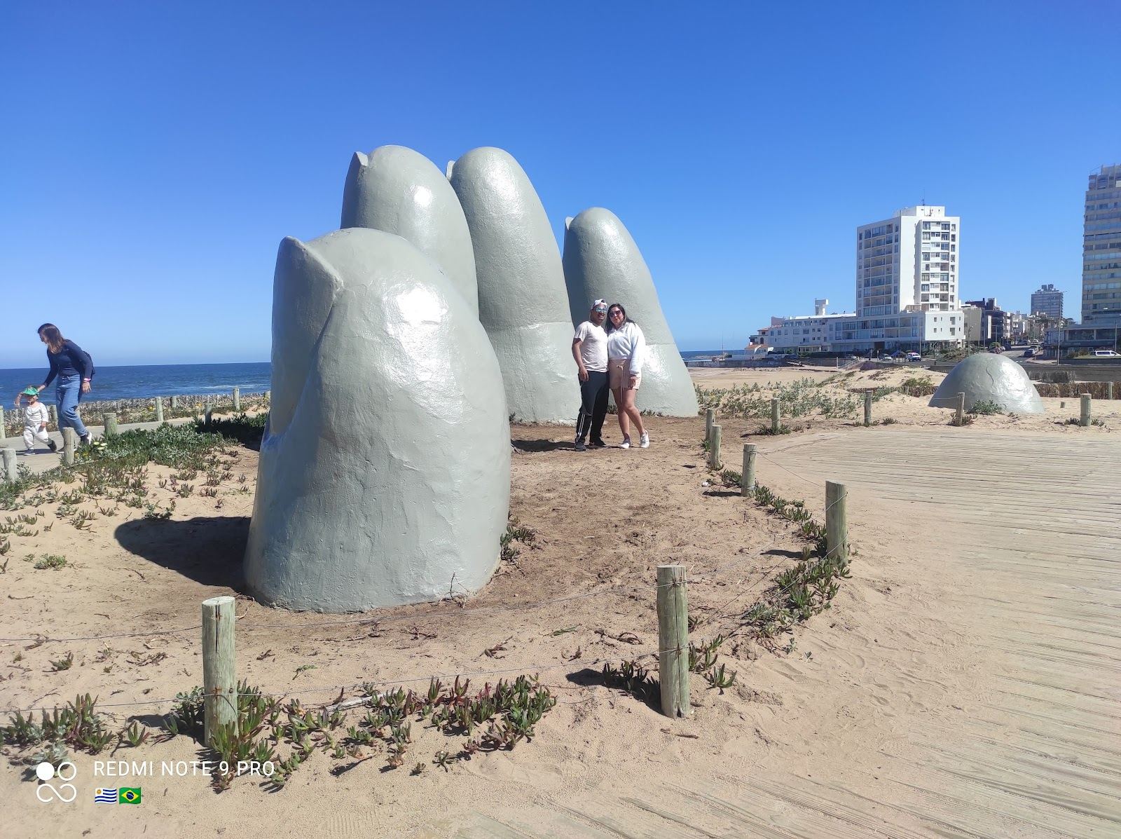 Playa Brava Punta del Este golden sand and Atlantic surf with the Hand sculpture nearby