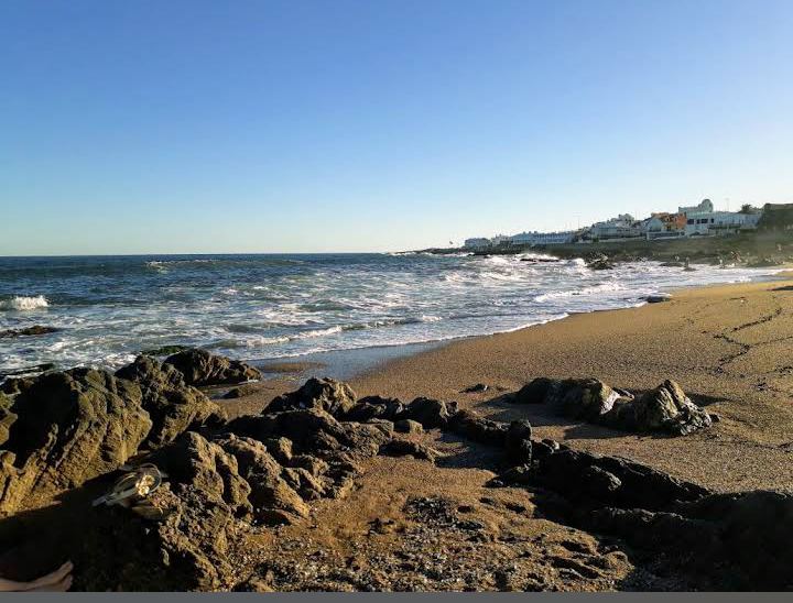 Playa de los Ingleses Punta del Este rocky exposed beach at the peninsula tip