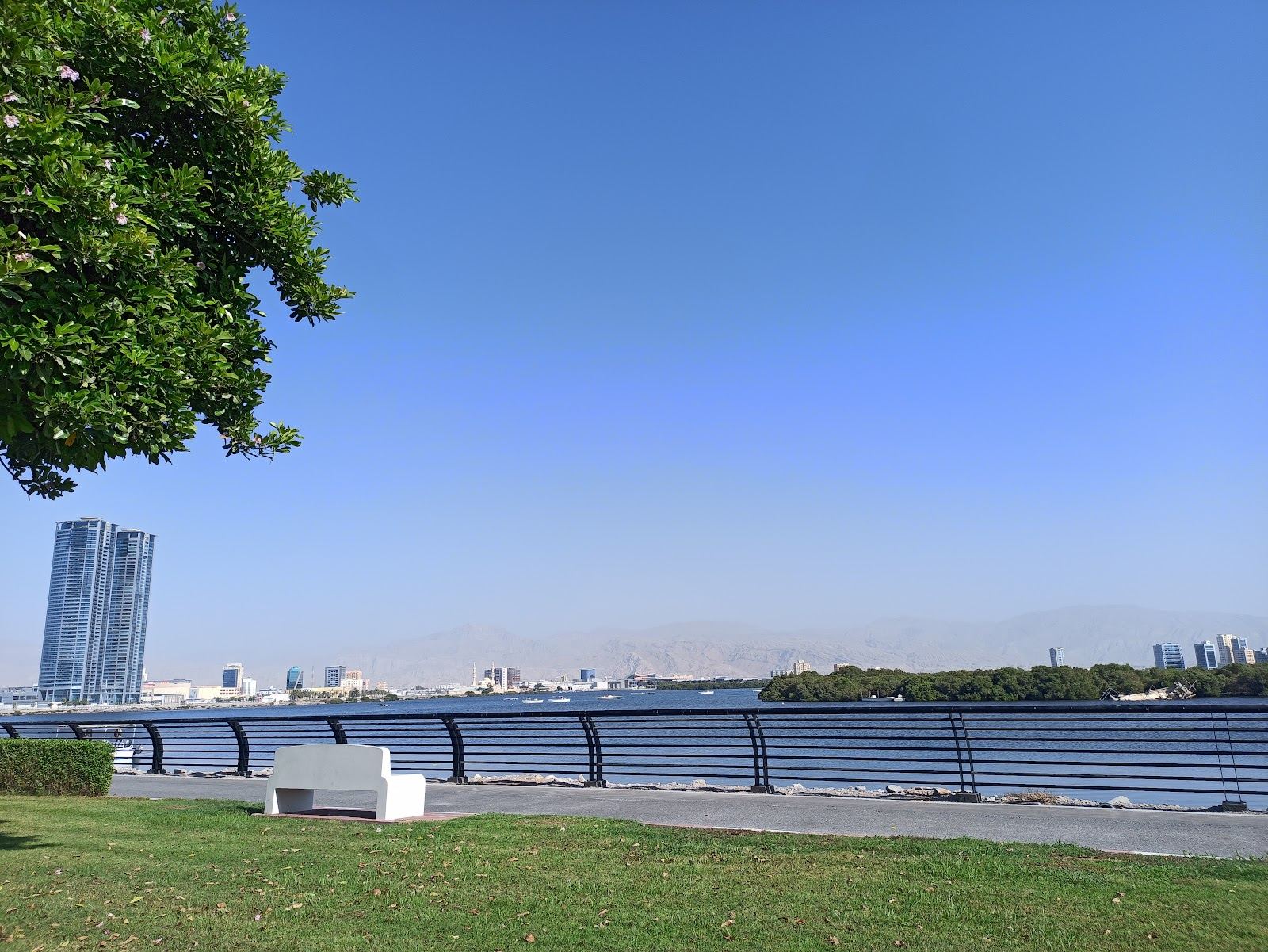 The free public corniche beach and calm bay water in Ras Al Khaimah city