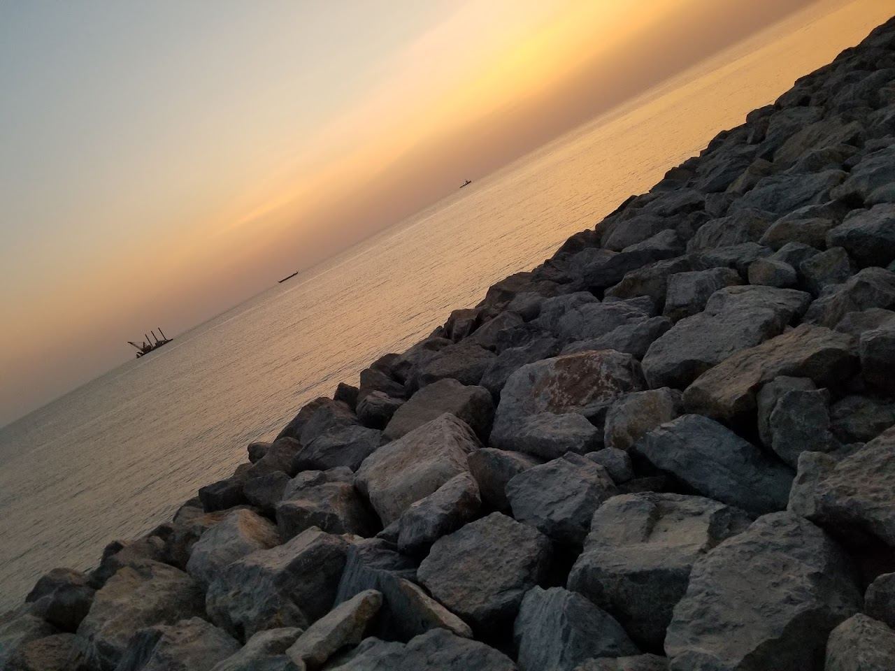 Calm Gulf water and sand at a beach on Al Marjan Island in Ras Al Khaimah