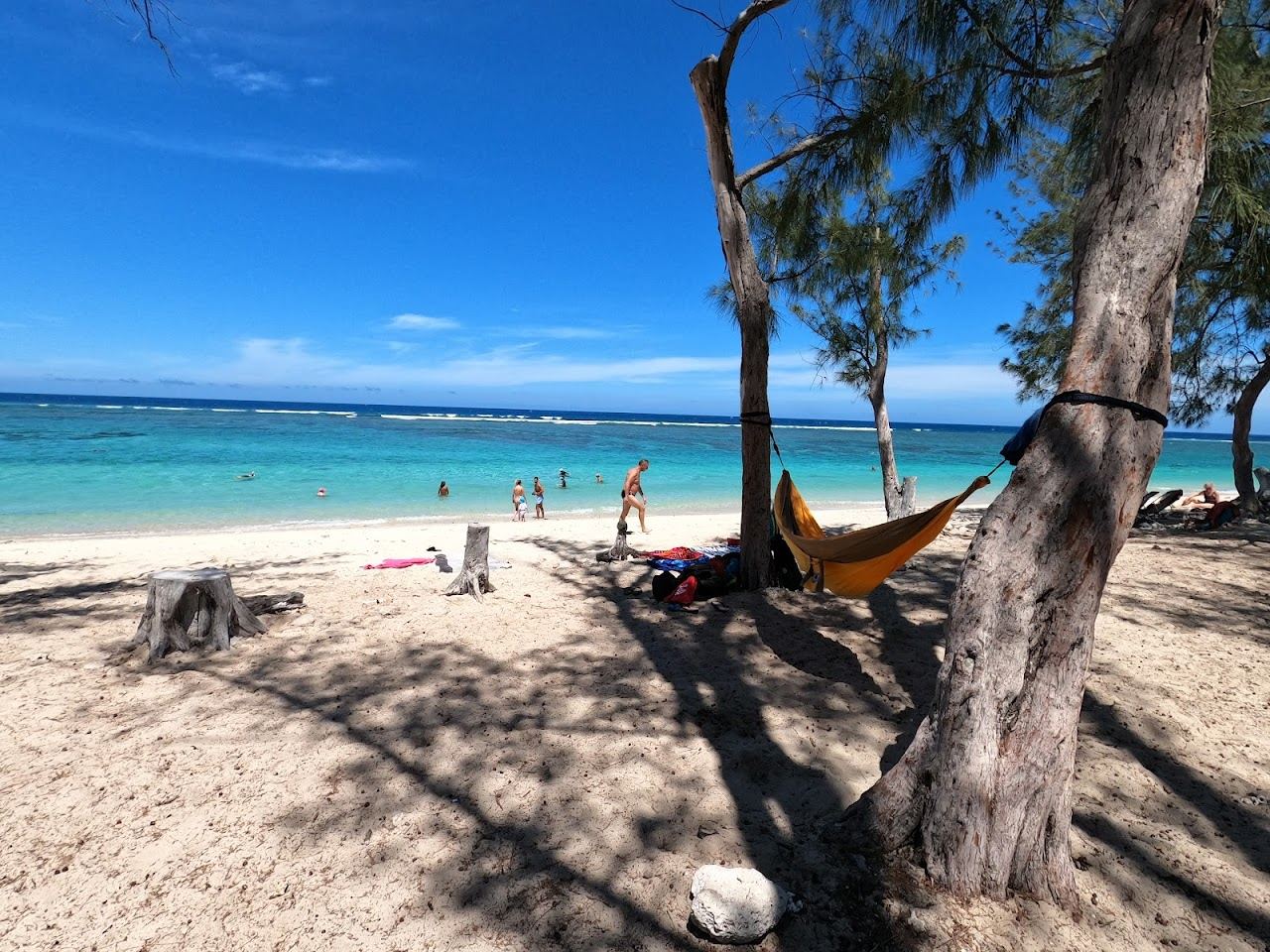 The turquoise reef lagoon and white sand at Plage de l Ermitage on the west coast of Reunion