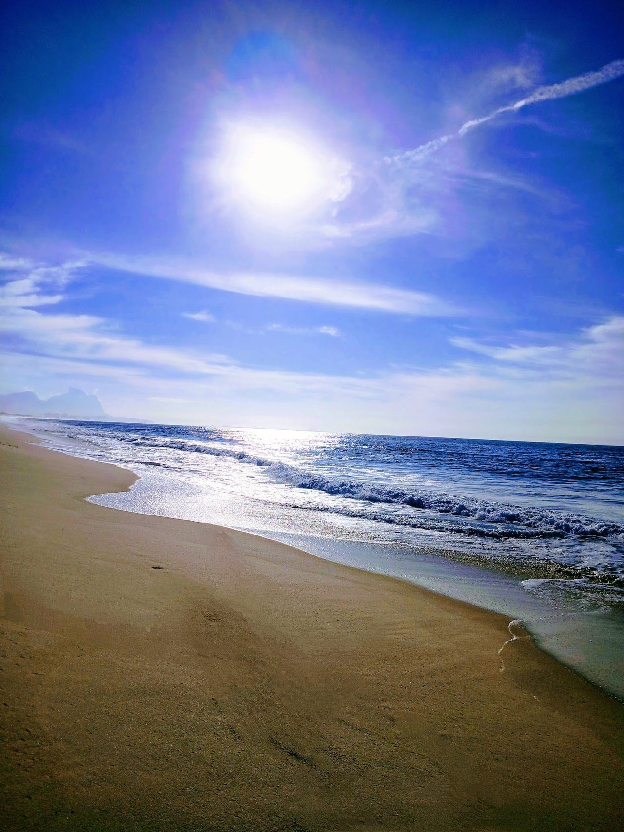 The long wide surf beach of Barra da Tijuca in Rio de Janeiro