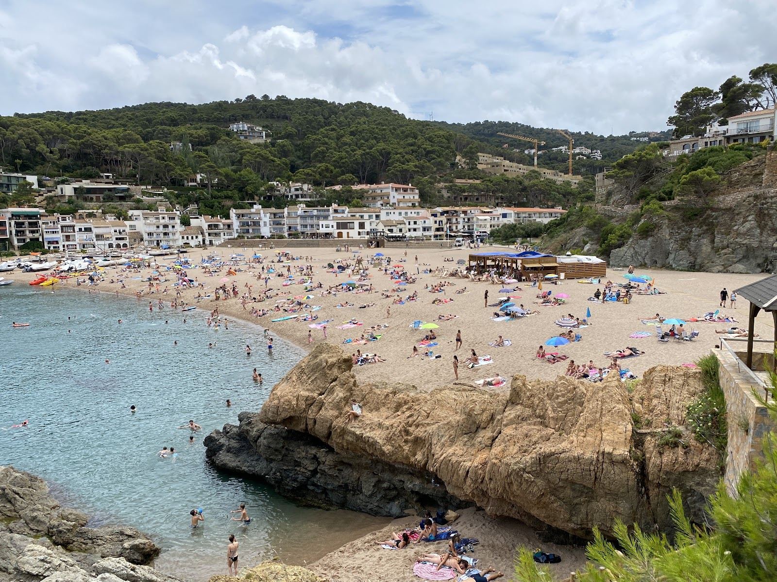 Sandy cove of Sa Riera backed by old houses near Begur on the Costa Brava