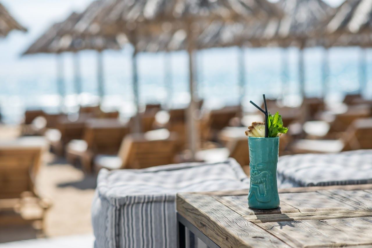 The pale sand and shallow clear water of Santa Maria beach on the northeast coast of Paros