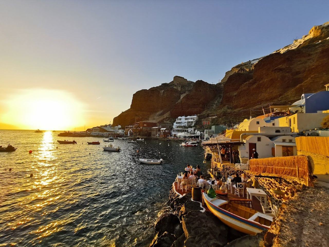 Whitewashed houses above the water at Ammoudi Bay below Oia in Santorini