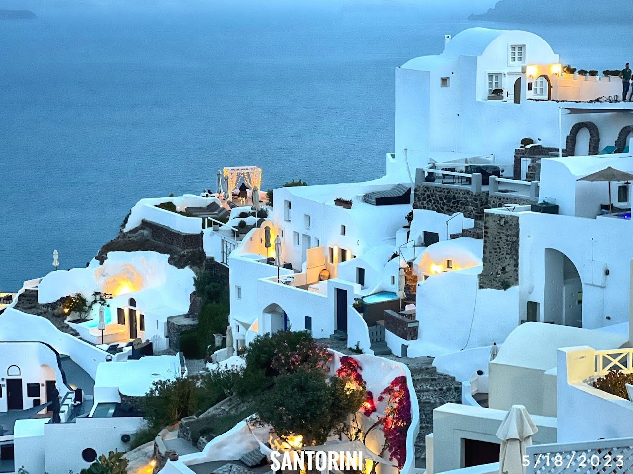Whitewashed houses and blue domes above the caldera at Oia on Santorini in Greece