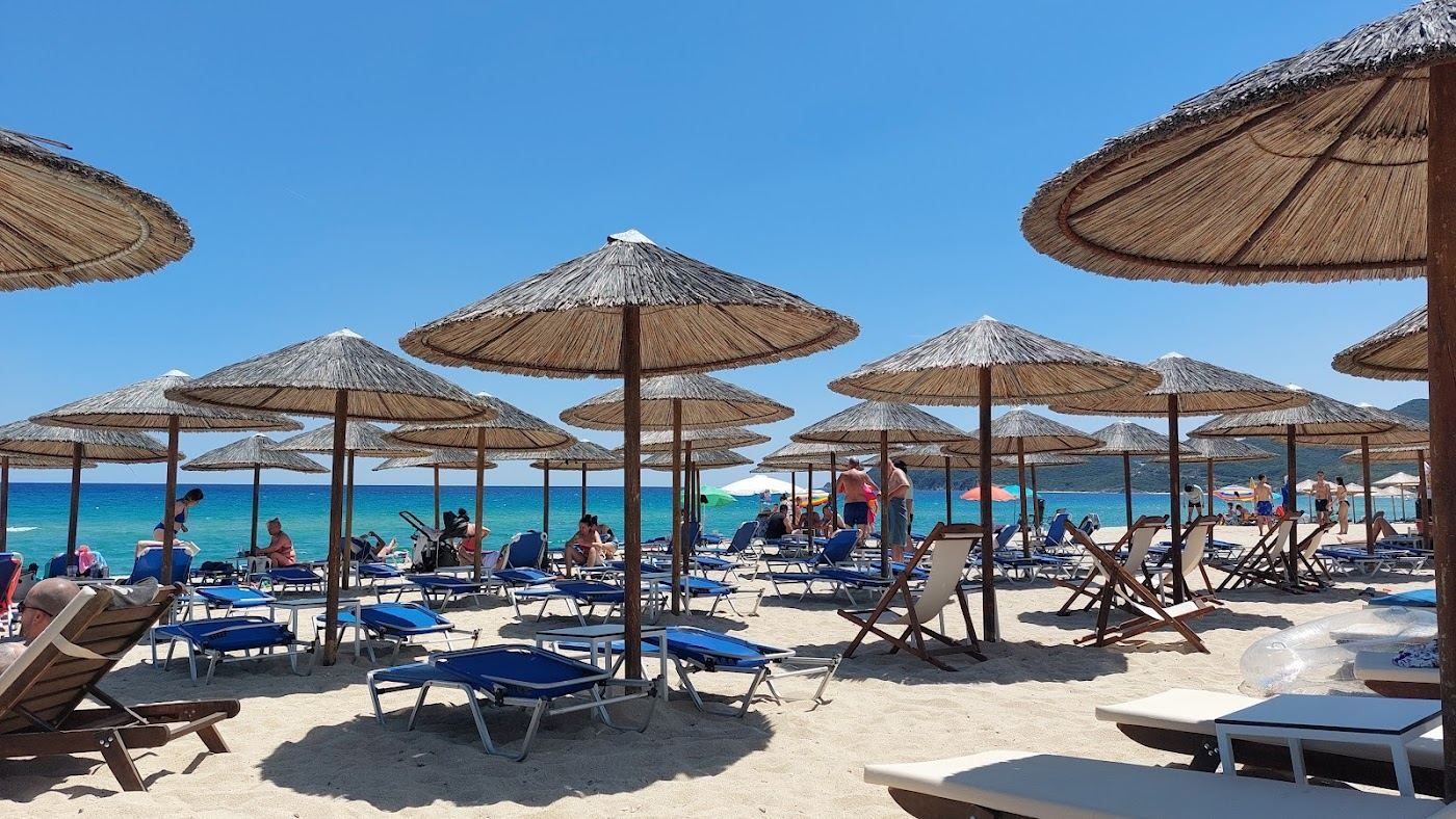 Clear emerald water and white sand with the Mount Athos view at Sarti on Sithonia in Halkidiki