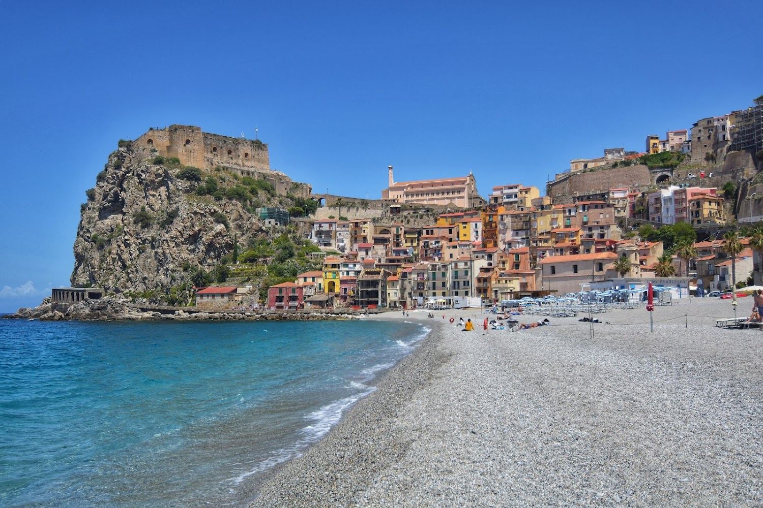 Sand and pastel houses at Scilla on the Calabrian coast
