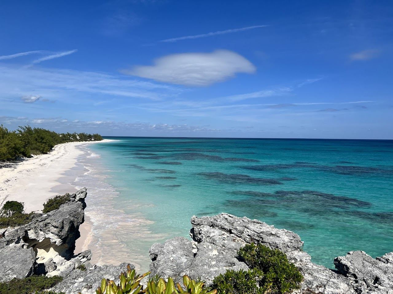 Pale pink tinged sand and two toned water at Lighthouse Beach on Eleuthera