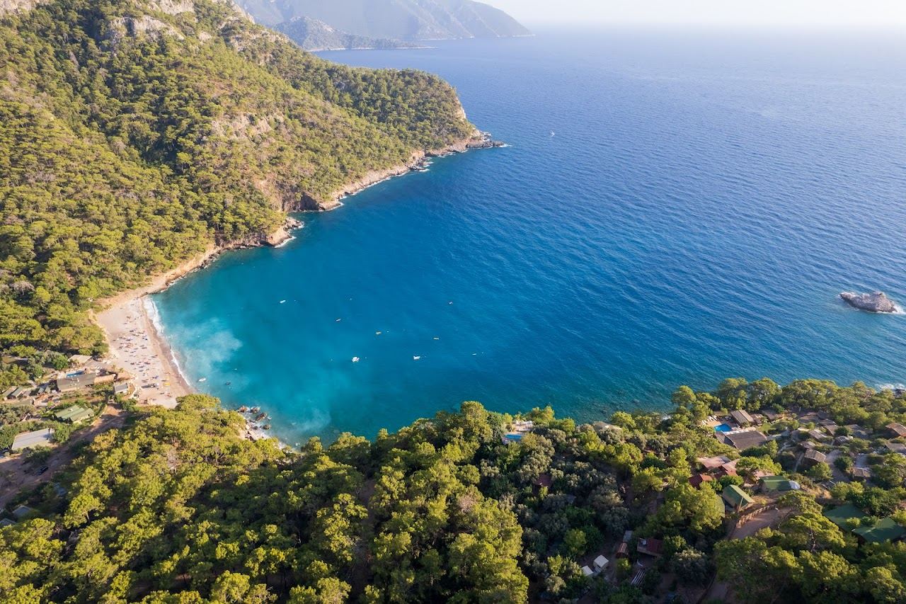 The forested valley dropping to the turquoise cove of Kabak near Oludeniz