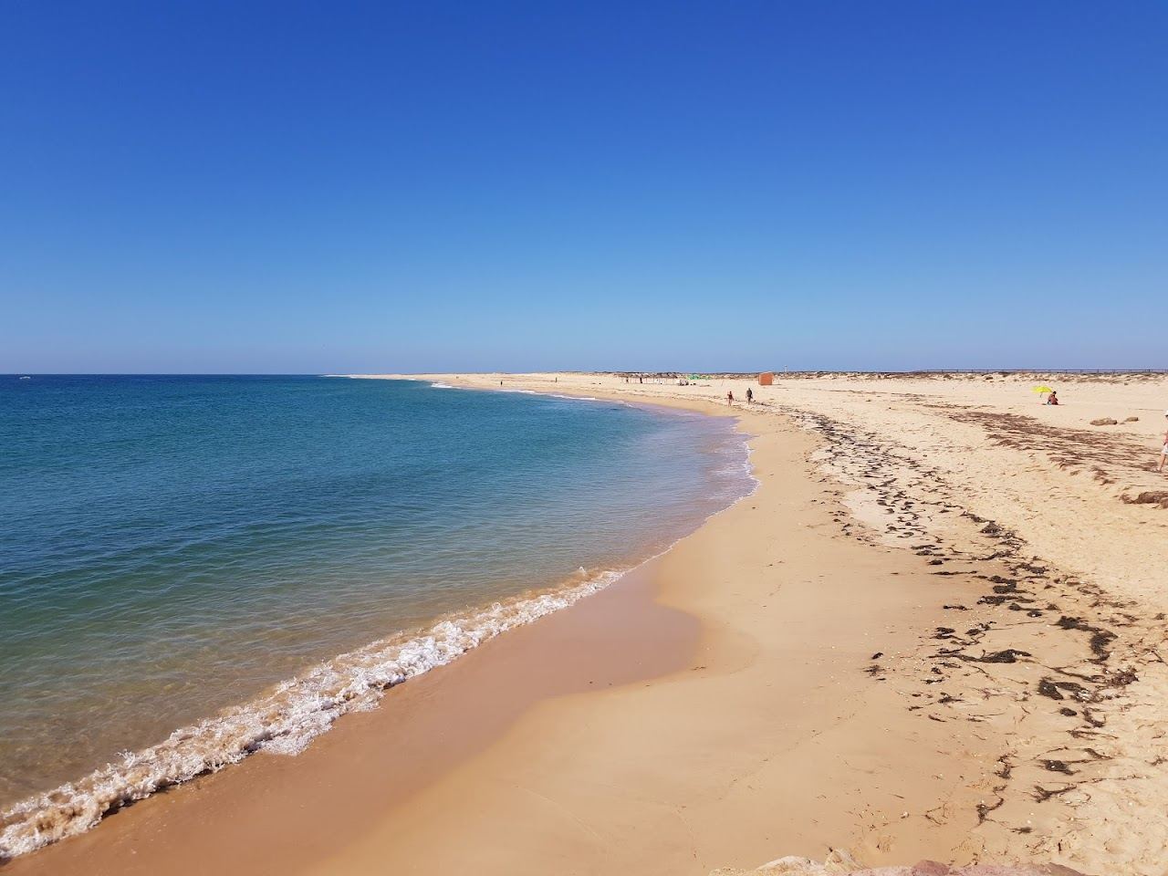 The empty Atlantic sands and dunes of Ilha Deserta off Faro in the Algarve