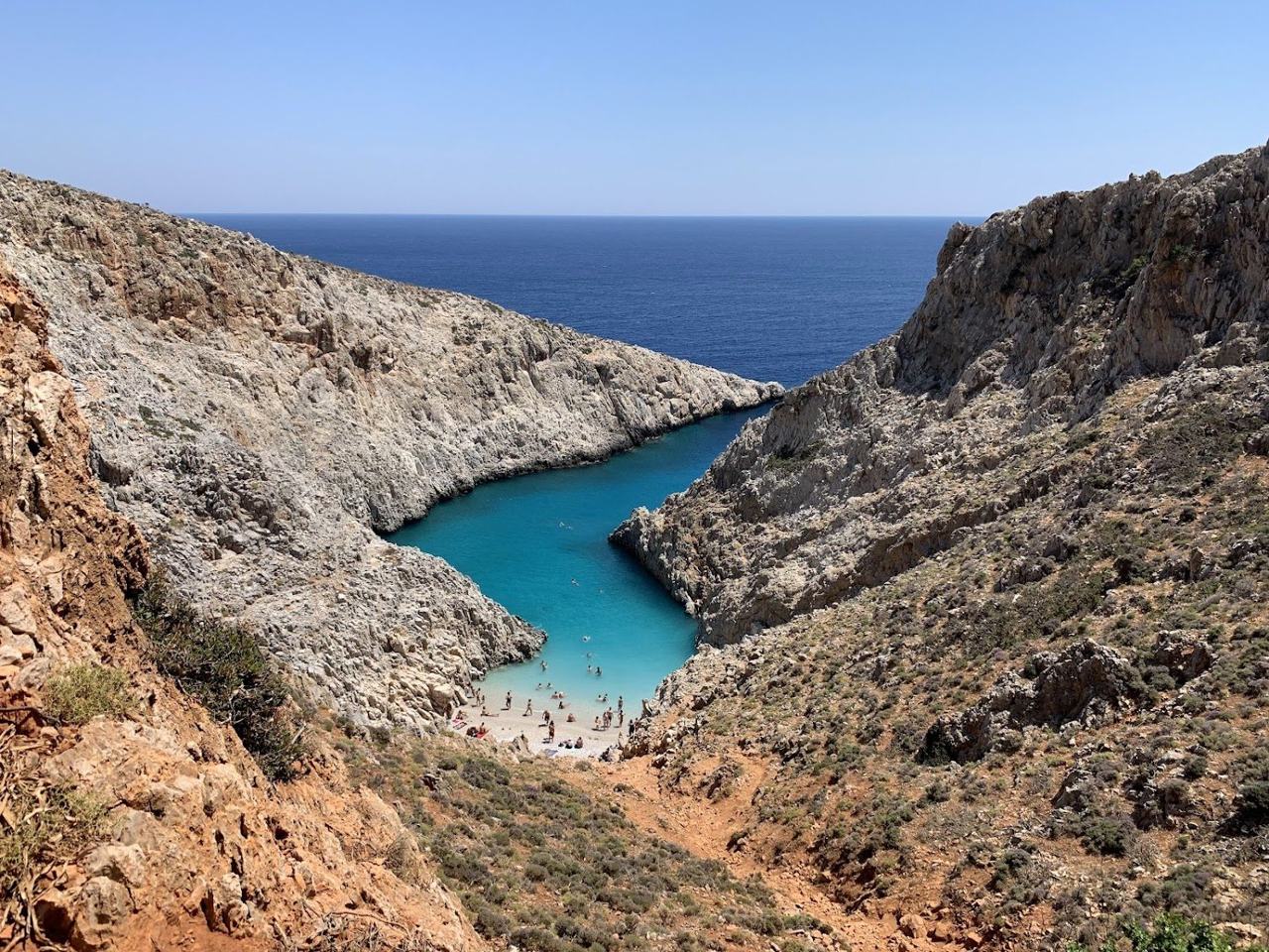 Steep cliffs and clear blue water at the narrow Seitan Limania inlet in Crete