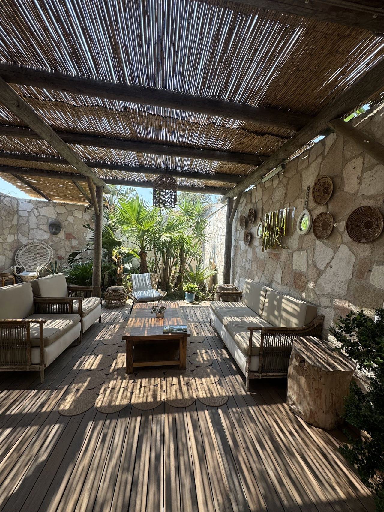 Late Aegean summer with warm calm sea, stylish beach clubs and the crowds tailing off.