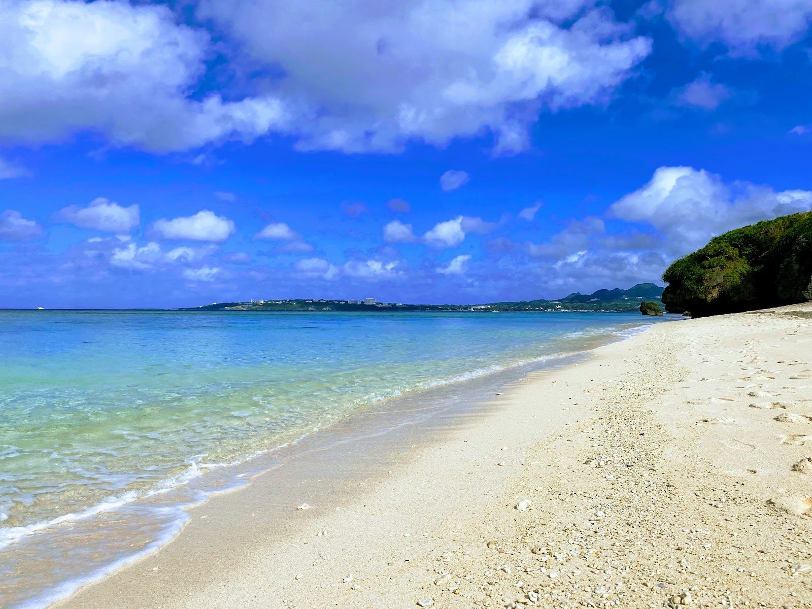 The clear water and bridge causeway of Sesoko Beach in northern Okinawa