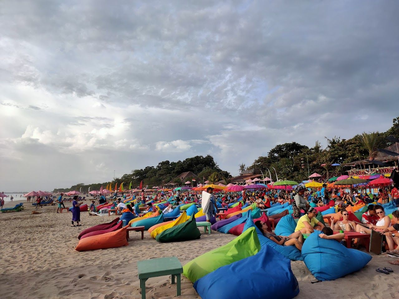 Wide sand and surf at sunset on the Seminyak coast, Bali, Indonesia