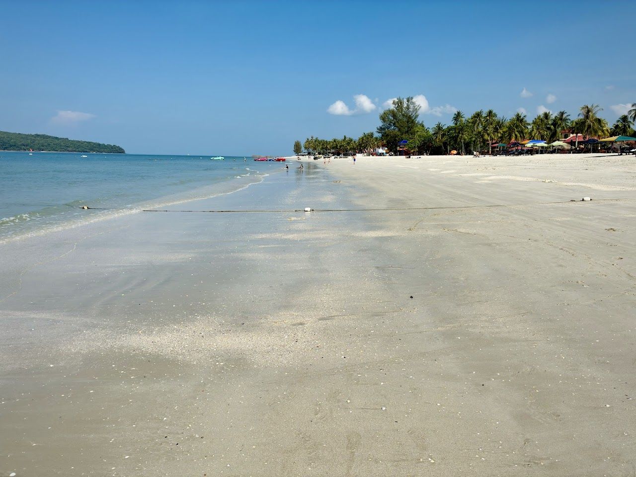 Soft sand and calm sea at Pantai Cenang on Langkawi, Malaysia