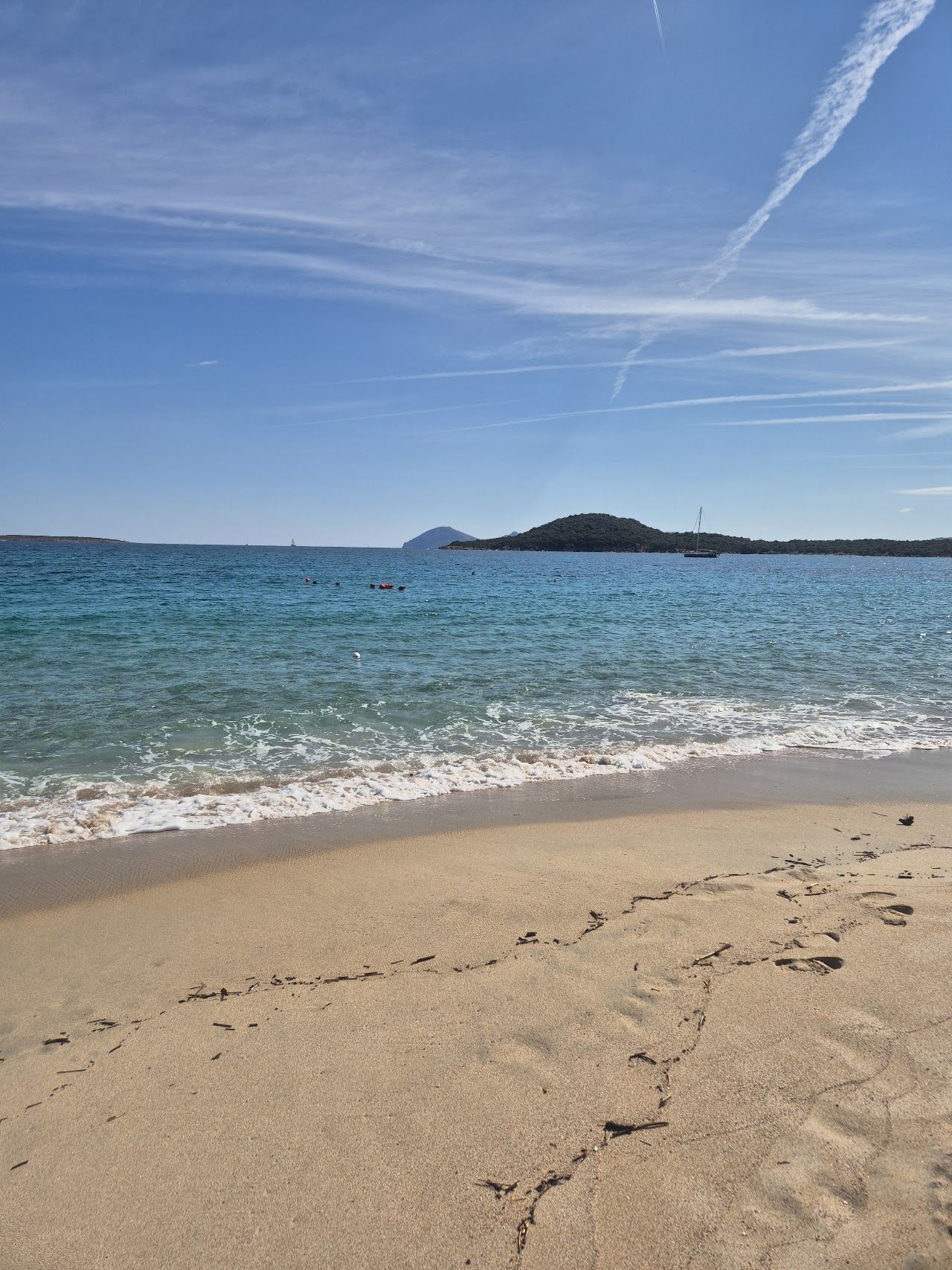 Turquoise shallows and pale sand along Liscia Ruja beach on the Costa Smeralda, Sardinia