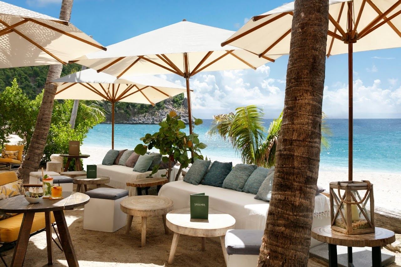 The Shellona beach club and sunbeds overlooking the shell cove at Shell Beach on St Barths