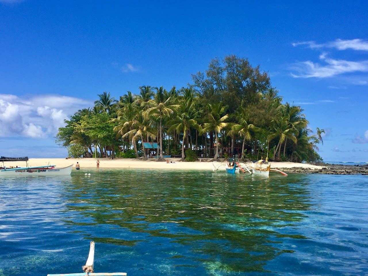 Clear shallow reef water off a small island near Siargao in the Philippines