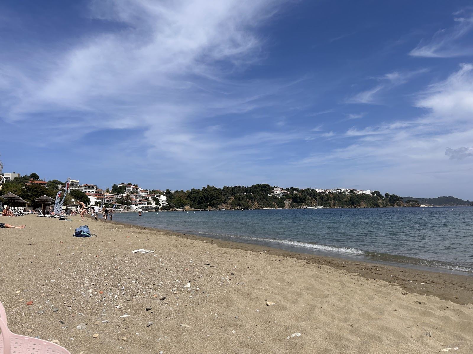 Shallow sheltered water and sunbeds along Megali Ammos beach close to Skiathos Town